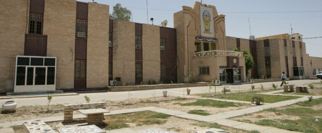 The Provincial Government Center in Ramadi, Iraq June 25. The government center was a key target for insurgents because it represented the prospects of peace and prosperity in the province. Marines, under constant attacks, refused to give up the building to guerillas. The attacks became a daily part of life for them. “We received plenty of small arms and indirect fire along with rocket-propelled grenades and roadside bombs always popped up,” said 1st Sgt. Patrick J. Dostal, the Headquarters and Service Company first sergeant with 1st Battalion, 9th Marine Regiment, Regimental Combat Team 1, who served in Ramadi in 2006 and is on his second deployment to the city. “But, I always knew the Marines would do whatever they needed to do to protect our area of operation around the center.”(Official U.S. Marine Corps photo by Sgt. Jeremy Giacomino) (RELEASED)