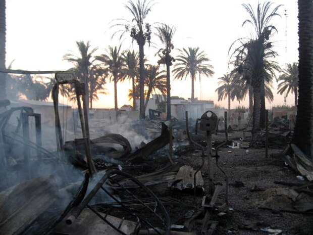 FALLUJAH, Iraq (June 25, 2008) –Marines of Company L, 3rd Battalion, 6th Marines suffered a fire June 25 that destroyed Entry Control Point-5 (ECP-5), a post where Marines and Iraqi Police control traffic and safeguard entrants into the city of Fallujah. After four weeks, the company rebuilt and received an outpouring of support from people back home, neighboring units and local Iraqis. (Official U.S. Marine Corps photo by Company L, 3rd Battalion, 6th Marines) (RELEASED)