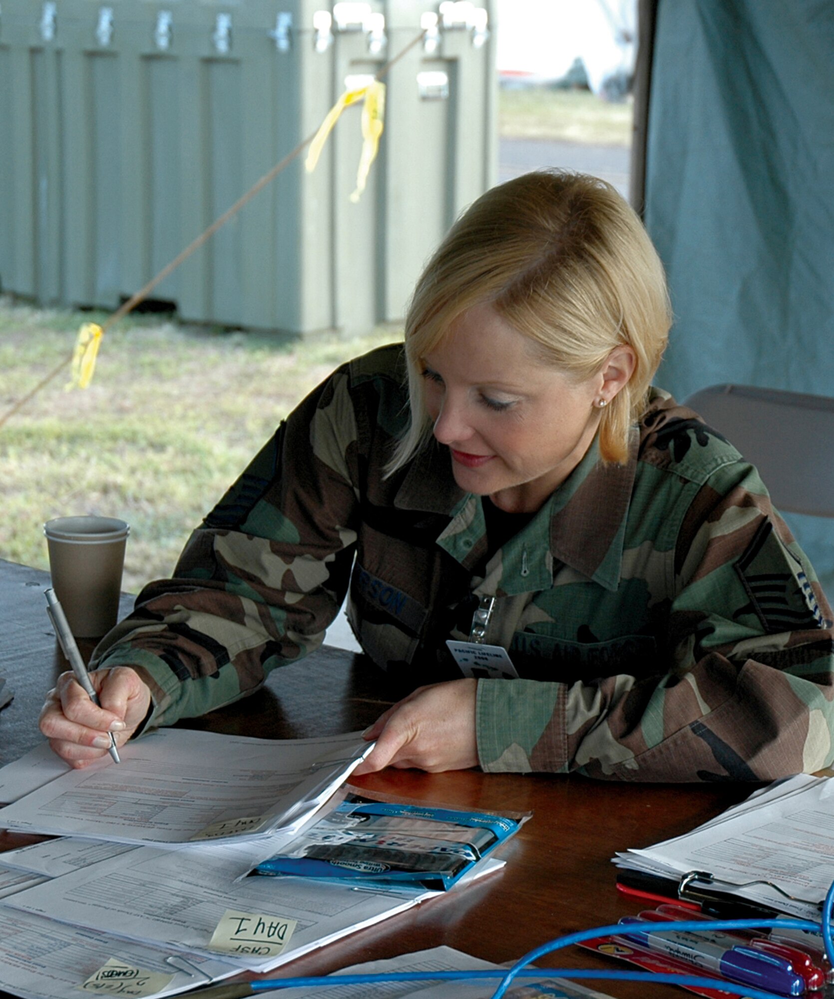 Master Sgt. Michelle Anderson creates patient records for the Pacific Lifeline exercise in February. A Reservist with the 446th Aeromedical Staging Squadron, McChord Air Force Base, Wash., Sergeant Anderson's performance at Pacific Lifeline earned her an invitation to the international exercise called MEDCEUR that took place May 2-14 in Croatia.  (U.S. Air Force photo/Capt. Jennifer Gernardt)  