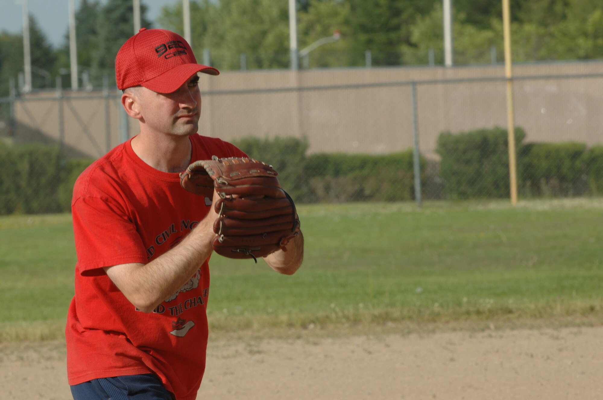 FAIRCHILD AIR FORCE BASE, Wash. – Staff Sgt. Gregory Edelstein, 92nd Civil Engineer Squadron training manager, prepares for his pitch during the 92nd CES vs. 92nd Operation Support Squadron softball game here June 25. (U.S. Air Force photo / Senior Airman Jocelyn Ford)