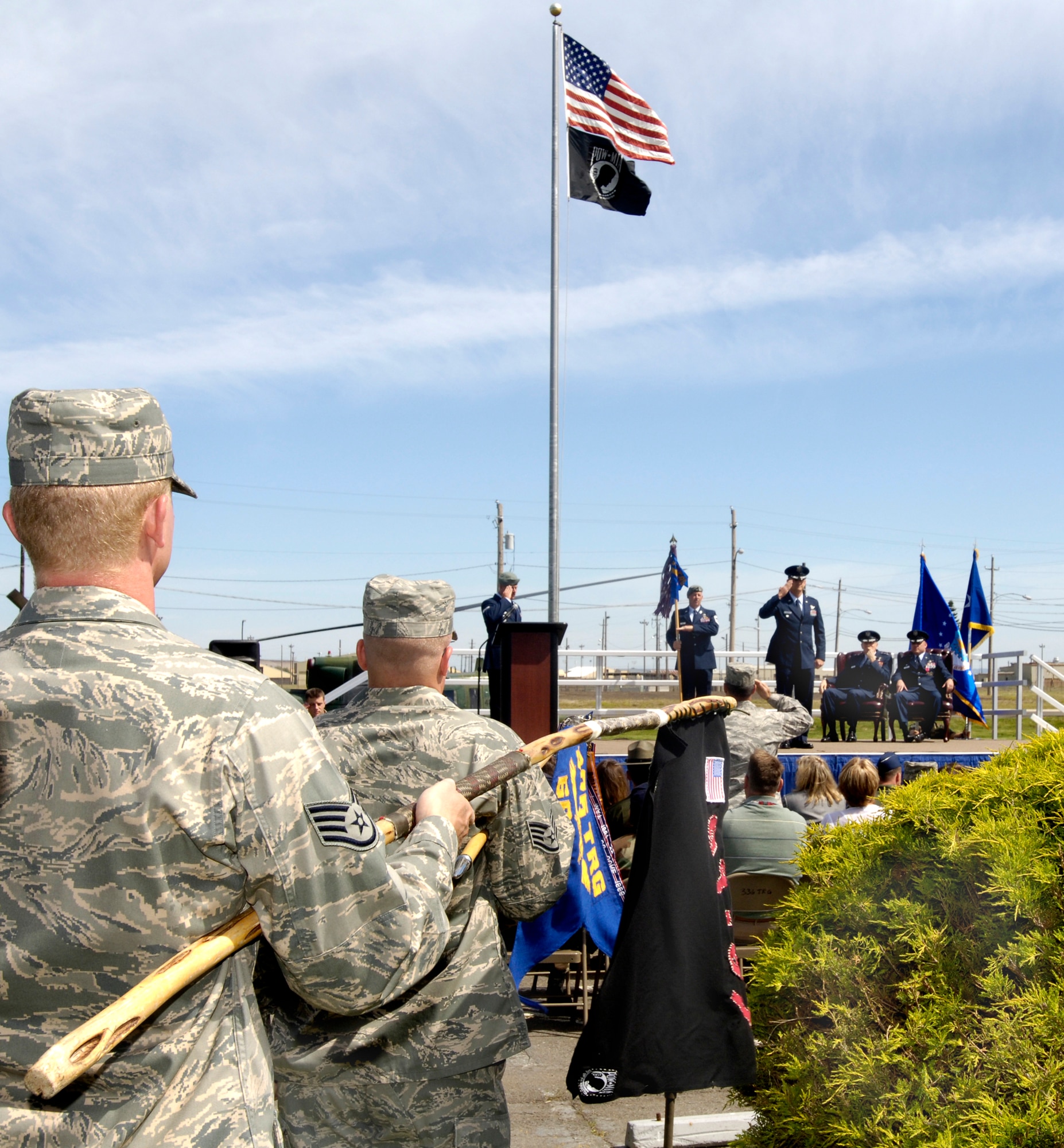 FAIRCHILD AIR FORCE BASE, Wash. – Maj. Gen. Irving Halter, 19th Air Force commander, presents Col. Scott Greene, 336th Training Group commander, with the group guideon during the 336th TRG change-of-command ceremony here June 26. Colonel Greene has held operational assignments in four major commands and in four different countries, with experience in the Pacific, European, and Central Command areas of operation.  (U.S. Air Force photo / Senior Airman Eunique Stevens)
