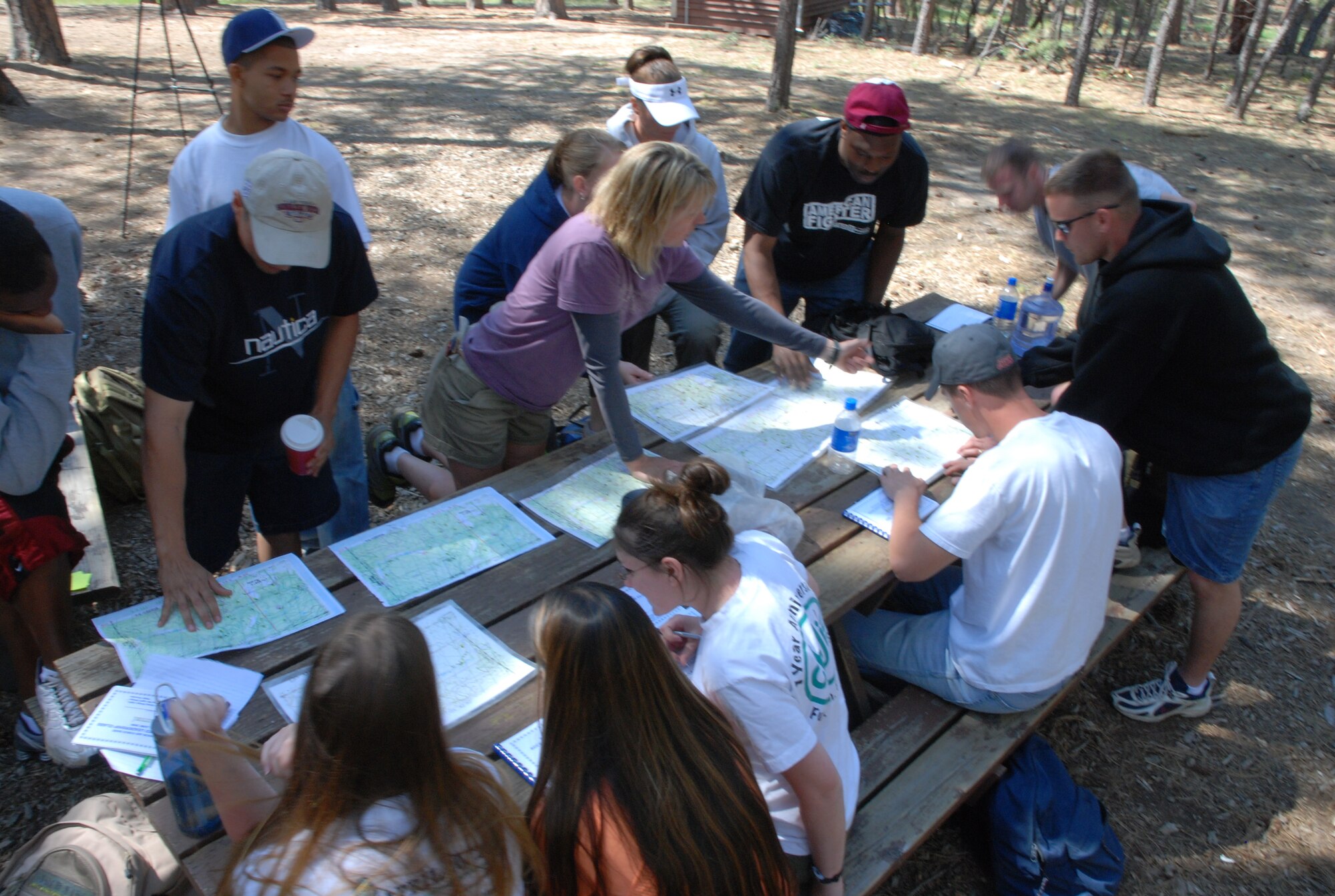 Airmen learn how to read a map and compass just before a land orientation exercise at the Accelerated Leadership Course June 19. Twelve Airmen attended the five-day leadership pilot program, aimed at developing Airmen and junior non-commissioned officers between professional military educational opportunities. (Air Force Photo/Senior Airman Stephen Collier)