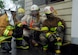 SOTO CANO AIR BASE, Honduras--Joint Task Force-Bravo fire inspector Mr. Herberth Gaekel (left) provides instruction to Honduran fire inspectors before the enter the burn house, a two-level training structure used to provide firefighters with a realistic firefighting experience. The fire inspectors are participating in a JTF-Bravo-sponsored firefighting subject matter expert exchange which focuses on facility inspection and fire investigation procedures. (U.S. Air Force photo by Tech. Sgt William Farrow)