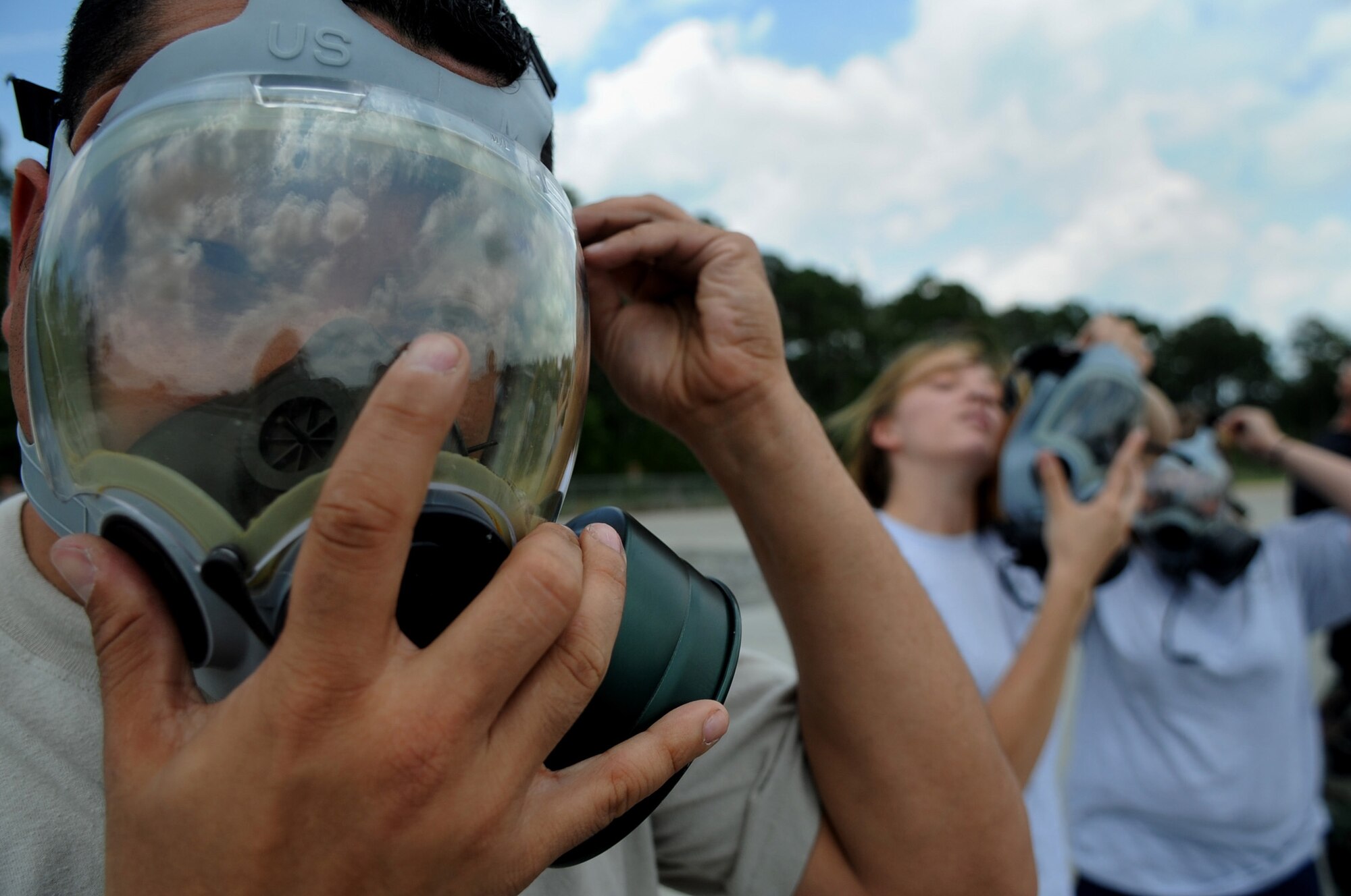 MOODY AIR FORCE BASE, Ga. -- Staff Sgt. Jose Santiago, 23rd Equipment Maintenance Squadron aircraft structural maintenance craftsman, puts on his gas mask during chemical warfare training here June 23. (U.S. Air Force photo by Senior Airman Gina Chiaverotti) 