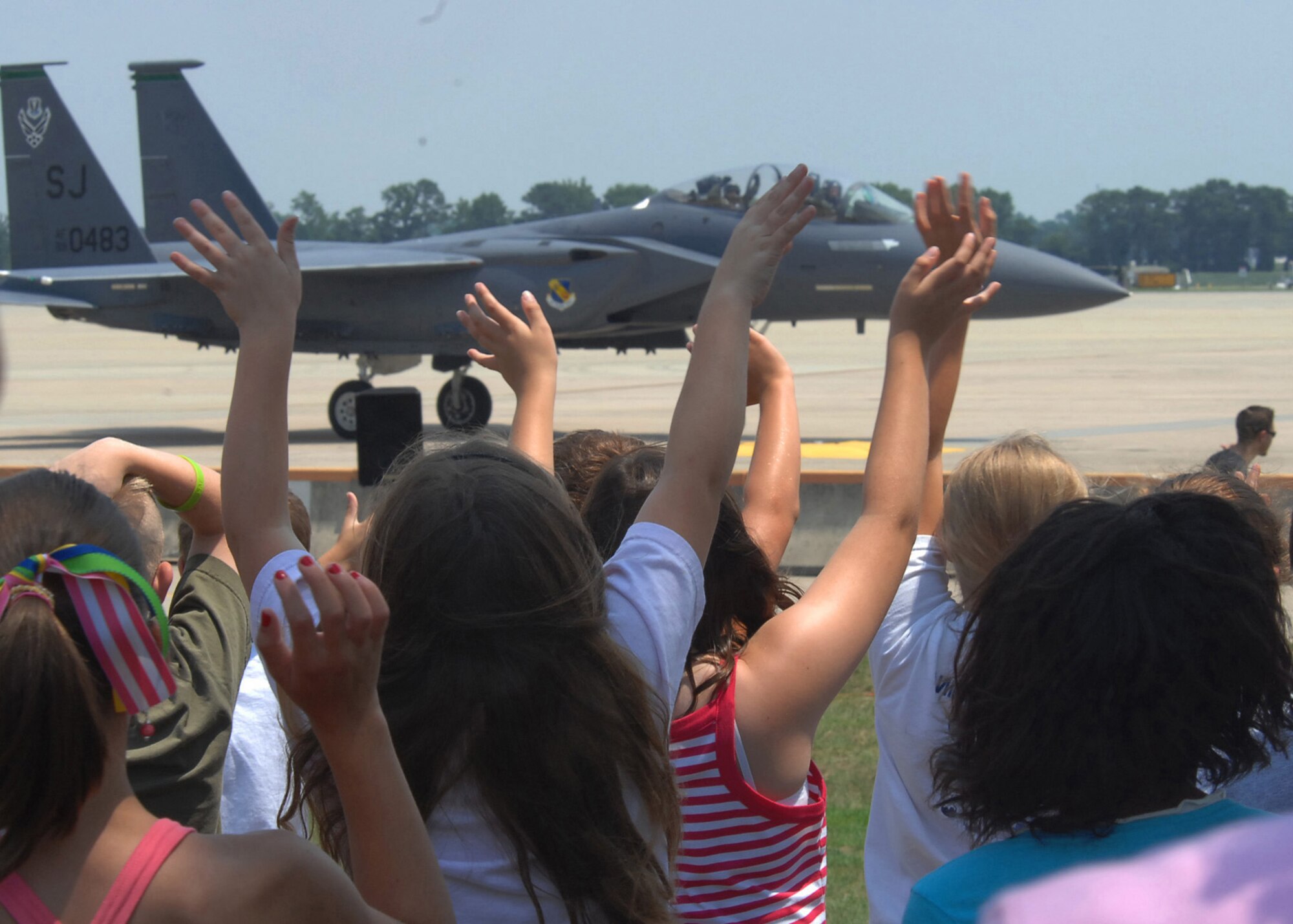 SEYMOUR JOHNSON AIR FORCE BASE, N.C. - Children participating in STARBASE, a program to raise interest and improve the knowledge and skills of youth in math, science, and technology, wave to the F-15E Demo Team pilots, June 17, 2008. The children had just witnessed the Demo Team perform several in-flight maneuvers as a display of the 4th Fighter Wing's aerial capabilities. (U.S. Air Force photo by Airman 1st Class Makenzie R. Lang)