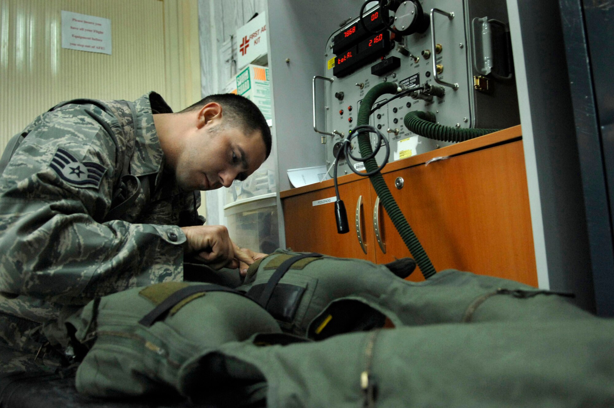 Staff Sgt. Matt Vincent inspect for any leaks in the air bladders of an anti-G suit June 23 at Joint Base Balad, Iraq. The suit is worn by F-16 Fighting Falcon pilots to combat the gravitational forces experienced during high-speed maneuvers. The suit prevents blood from rushing rapidly out of the brain, helping the pilot to maintain consciousness during flight. The technicians are responsible for the maintenance and operability of all the F-16 pilot gear, including their helmets and survival equipment. Sergeant Vincent is a 77th Expeditionary Fighter Squadron aircraft equipment technician deployed from Shaw Air Force Base, S.C. (U.S. Air Force photo/Senior Airman Julianne Showalter) 