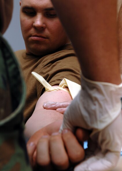 BARKSDALE AIR FORCE BASE, La. -- Members of the Naval Mobile Construction Battalion 28 put skills they learned in a life-saving combat exercise to use here on June 20. The Seabees as they are more commonly called are participating in a four day long exercise to prepare the unit for deployment. (U.S. Air Force photo by Airman 1st Class Brittany Y.Bateman)(RELEASED)