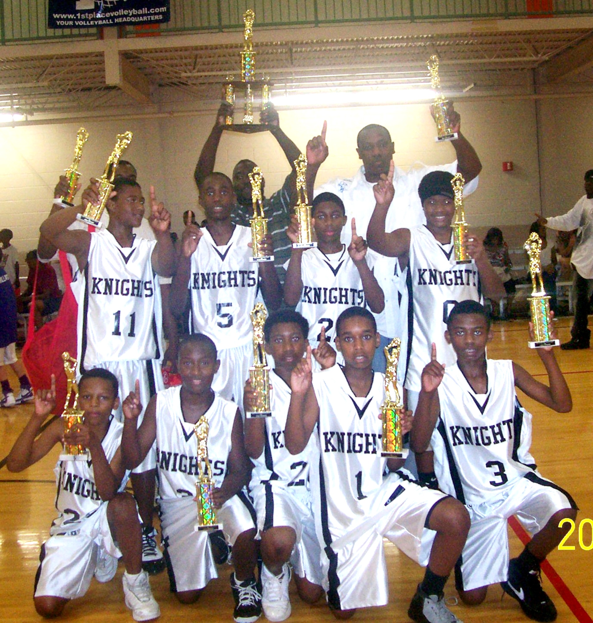 Members of the Perry Knights basketball team display trophies for winning the Youth Basketball of America 12-and-under Division II state championship. The Team will now compete in the YBOA national championships in Orlando, Fla. Courtesy photo