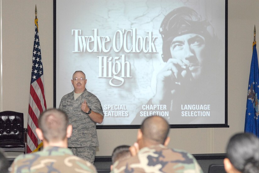 Master Sgt. John Bangs, 305th Logistics Readiness Squadron NCO in charge of war readiness, speaks to the audience before the start of “Twelve O’Clock High”, a classic World War II film, during a mentorship class hosted by the squadron’s Top IV June 20 here. The focus of the class was to discuss and learn about leadership and Operational Risk Management principles and situations. (U.S. Air Force photo/Carlos Cintron)