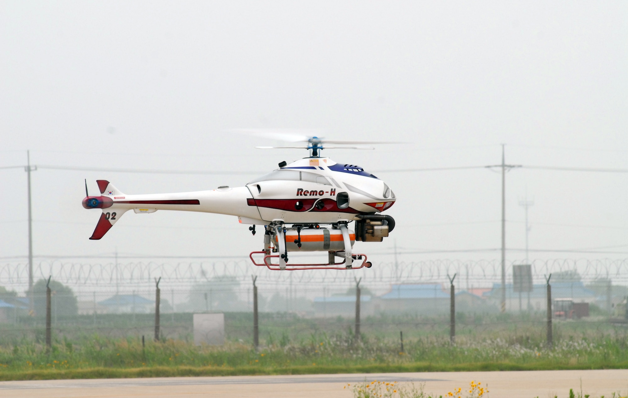 An unmanned aerial vehicle recon system belonging to the South Korean army flies June 24 over Kunsan Air Base, South Korea. South Korean army soldiers demonstrated the capabilities of their nuclear, biological and chemical detection technology during a two-day combined training session here June 23 and 24. (U.S. Air Force photo/Staff Sgt. Areceli Alarcon)