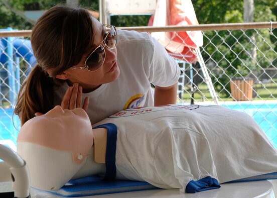 BARKSDALE AIR FORCE BASE, La. -- Head lifeguard Valerie Jacob, 2d Force Support Squadron, instructs fellow lifeguards on CPR procedures. The lifeguards on Barksdale support two pools ensuring the safety of patrons. Traditionally Barksdale's lifeguard positions were filled by local area college and high school students but this year there are two active-duty Airmen training and serving with their civilian counterparts. The need for active-duty lifeguards has increased because several forward deployed locations have pools, Jun. 11, 2008.  (U.S. Air Force photo by TSgt Laura K. Smith) (released)
