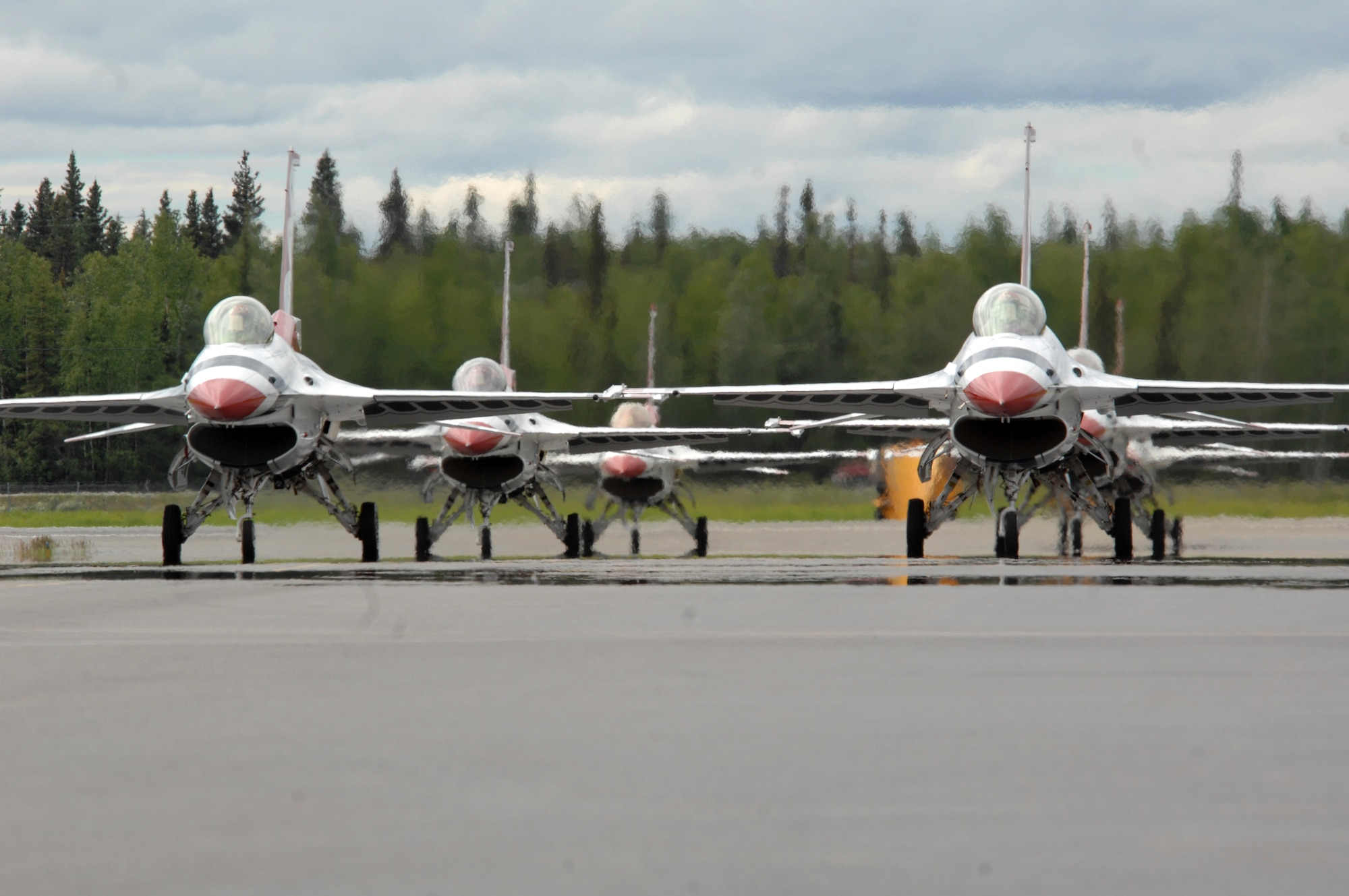 The Air Force Thunderbirds flight demonstration team taxi onto the flightline during the June 24 airshow at Eielson Air Force Base, Alaska, June 24. The Thunderbirds are assigned to the U.S. Air Force Air Demonstration Squadron at Nellis AFB, Nev. (U.S. Air Force photo/Staff Sgt. Tia Schroeder) 
