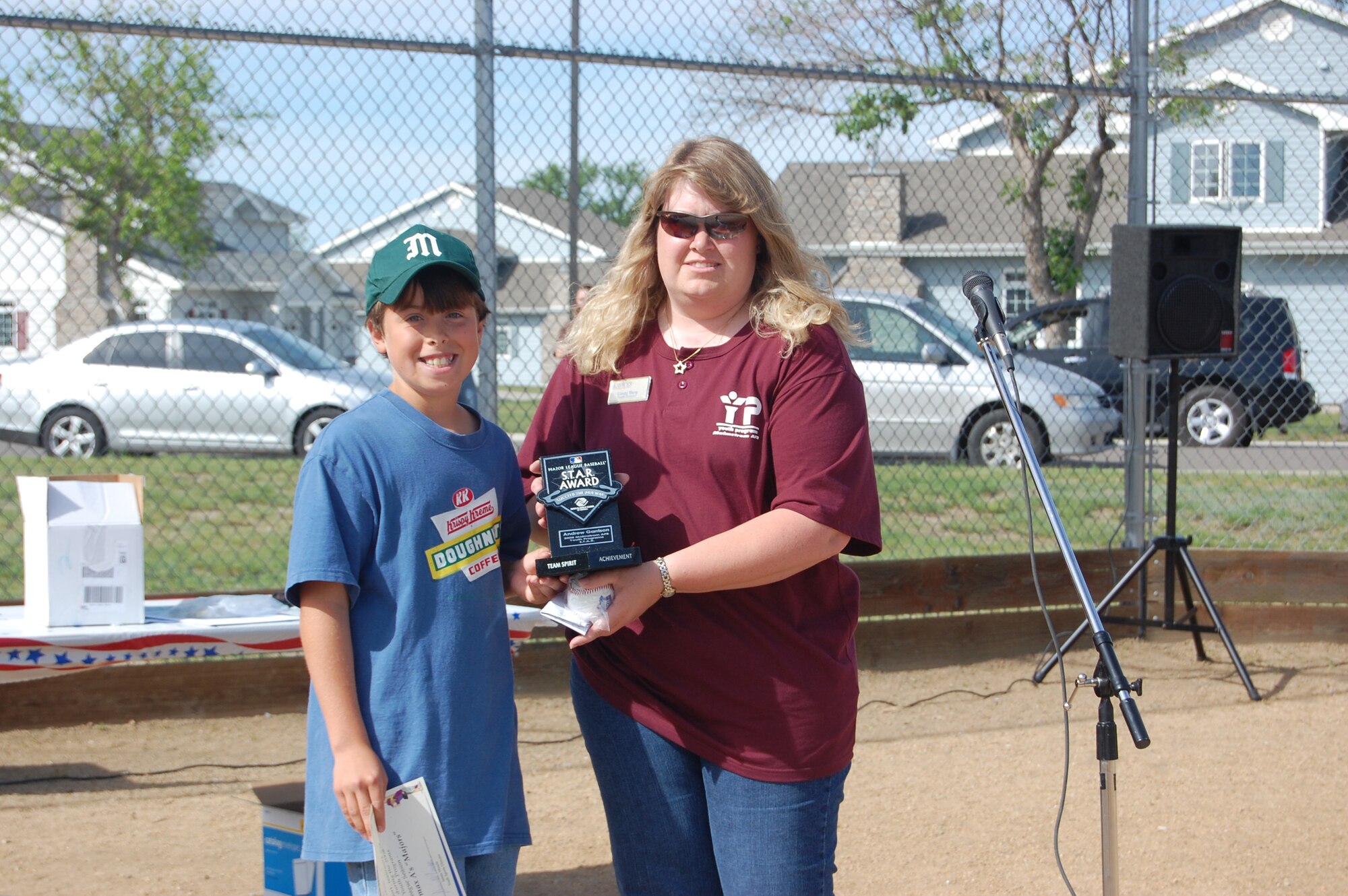 Andrew Garrison, 12, a member of the Malmstrom Youth Programs Center and catcher for the ACR Automax Little League team here, won the 2008 Major League Baseball S.T.A.R. Award for the State of Montana. Cindy Berg, Youth Programs Center youth program director, presented him with this award during the Little League closing day ceremony June 23. (U.S. Air Force photo/Airman 1st Class Emerald Ralston)