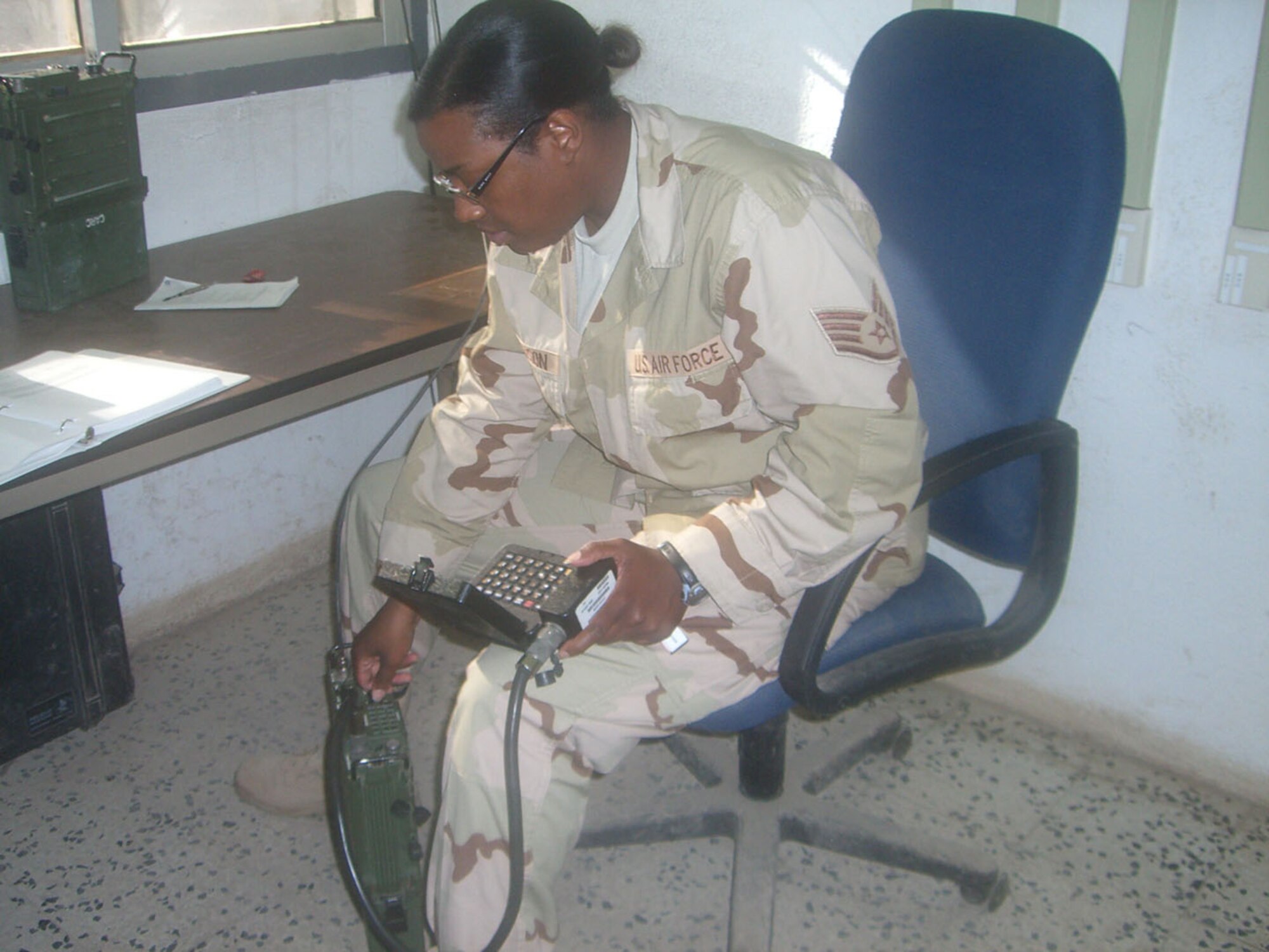 SEYMOUR JOHNSON AIR FORCE, N.C. -- Staff Sgt. Veronica Jefferson, a Reservist with the 916th Communications Squadron, works on a radio while deployed to Djibouti, Africa. Sergeant Jefferson is a communications systems journeyman.