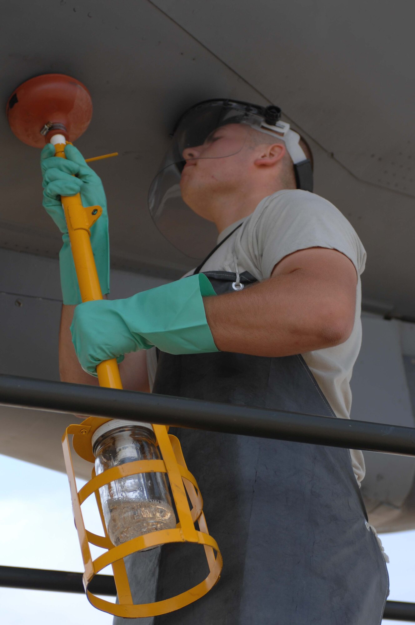 SEYMOUR JOHNSON AIR FORCE BASE, N.C. - Airman Edward Quarter of the 916th Air Refueling Wing drains the fuel tank sumps on a KC-135R Stratotanker, June 23, 2008, Seymour Johnson Air Force Base, NC. Airman Quarter drains the fuel sumps to check if there is any water in the fuel tanks. (U.S. Air Force photo by Airman 1st Class Gino Reyes)