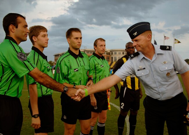 Col. John "Red" Millander greets game officials for the Charleston Battery match at the Blackbaud Stadium in Charleston, S.C, June 20. Colonel Millander is the 437th Airlift Wing commander and was invited to the game to do the coin toss in honor of military appreciation night. (U.S. Air Force photo/Airman 1st Class Katie Gieratz)