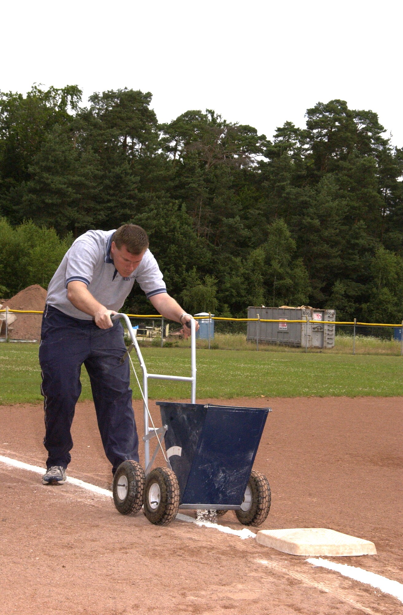 Tech. Sgt. Thomas Hoffman of the 193rd Special Operations Wing, Middletown, Pa., lines a softball field during Air National Guard annual training at Ramstein Air Base, Germany. Sergeant Hoffman is one of many Airmen from the 193rd SOW who went to Ramstein for training during June. Courtesy photo