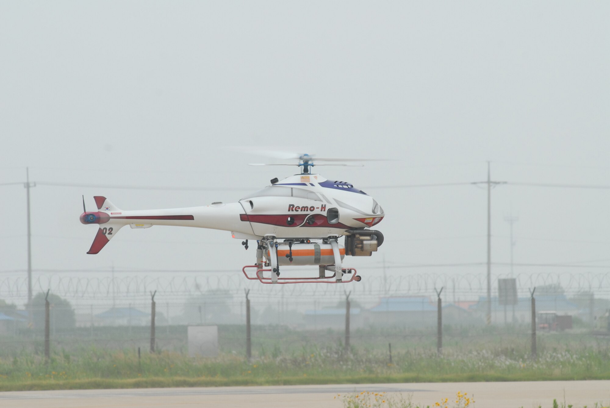 KUNSAN AIR BASE, Republic of Korea--An un-manned aerial vehicle recon system belonging to the Republic of Korea Army flies over Kunsan Air Base June 24,  ROKA soldiers demonstrated the capabilities of their NBC detection technology during a two-day combined training session here June 23 and 24. (U.S. Air Force photo by Staff Sgt. Areceli Alarcon)