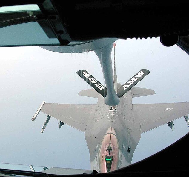 OSAN AIR BASE, Republic of Korea -- A KC-135 refuels a F-16 Fighting Falcon from the 36th Fighter Squadron during a refueling mission over the Korean Peninsula June 25. The KC-135 was flown by members of the 336th Air Refueling Squadron, March Air Reserve Base, Calif. (U.S. Air Force photo/Staff Sgt. Candy Knight)