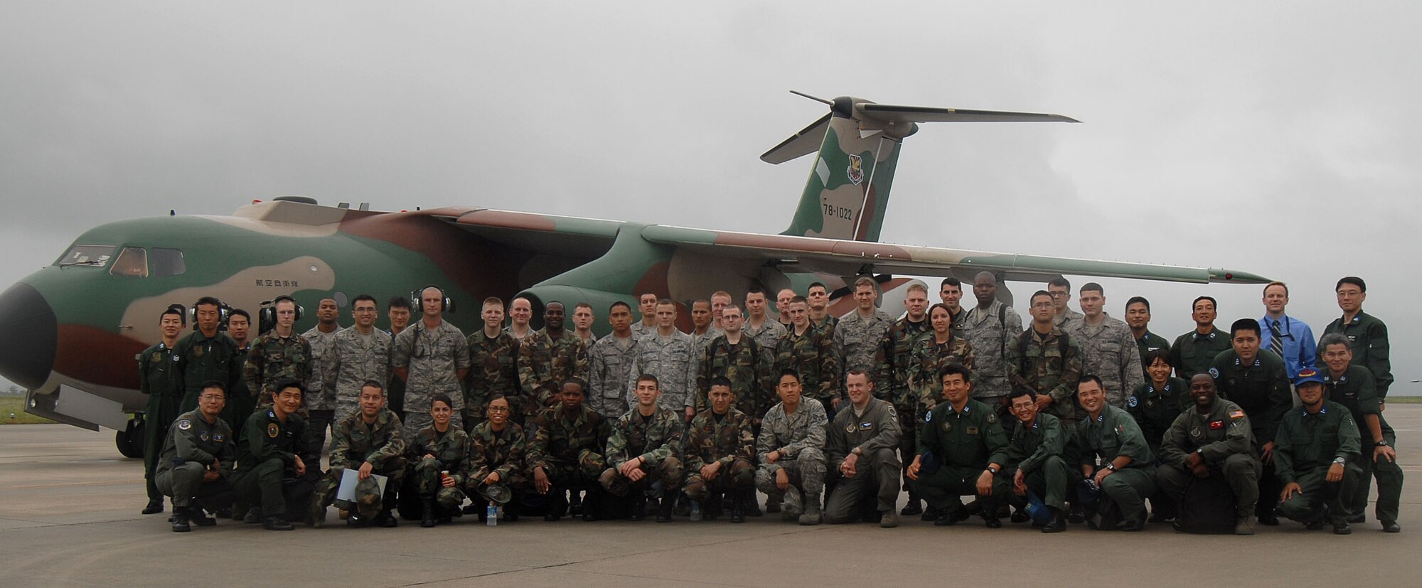 YOKOTA AIR BASE, Japan -- Japanese Air Self Defense Force and U.S. Air Force members pose for a group photo in front of a JASDF C-1 during a bilateral airlift aircraft training on 23 June.(U.S. Air Force photo by SrA Laszlo Babocsi)