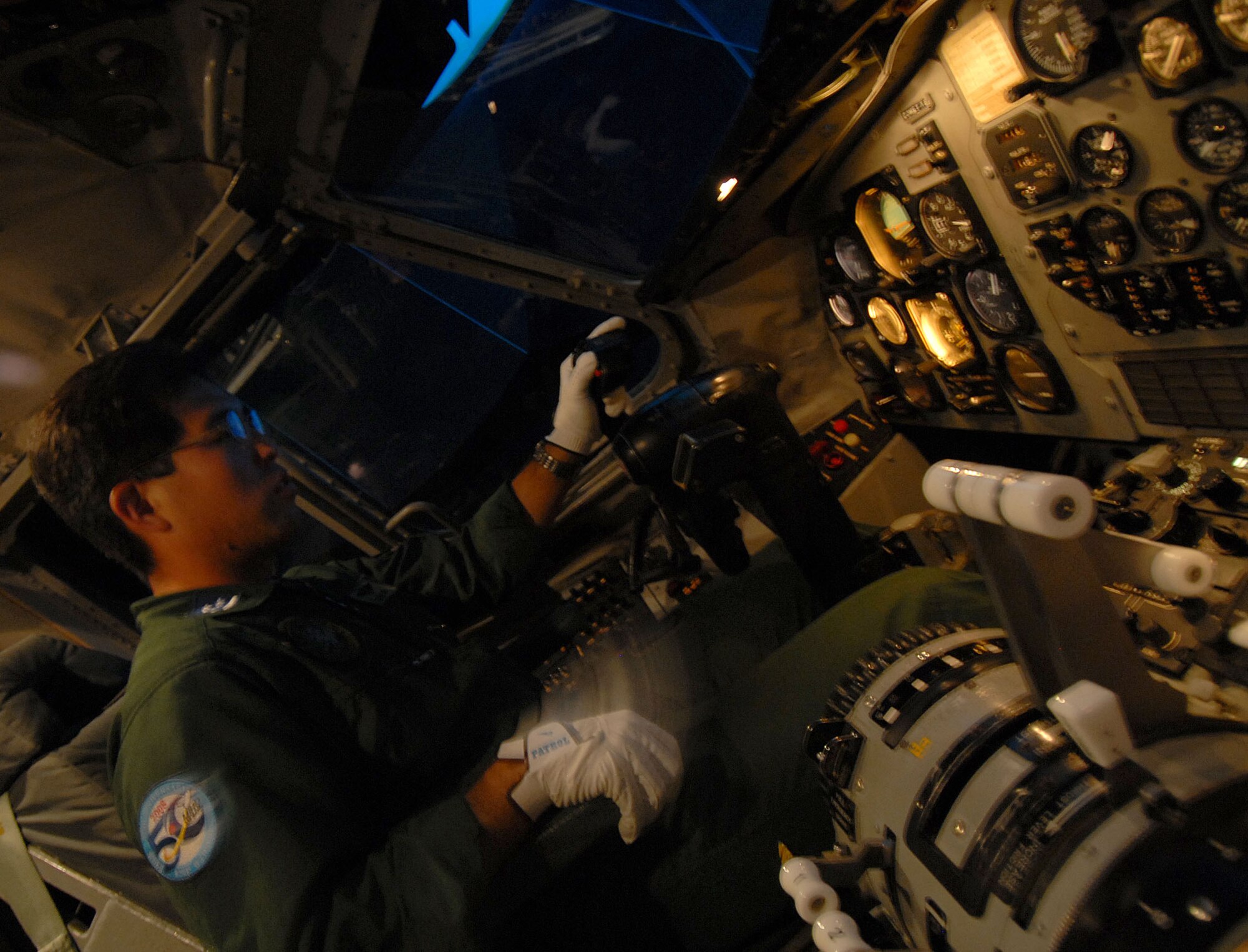 YOKOTA AIR BASE, Japan -- Japanese Air Self Defense Force's Captain Sumiura Masanori pilots a C-1 simulator as a demonstration at Miho Air Base, for visiting U.S. Air Force members during a bilateral airlift aircraft training on 23 June.(U.S. Air Force photo by SrA Laszlo Babocsi)
