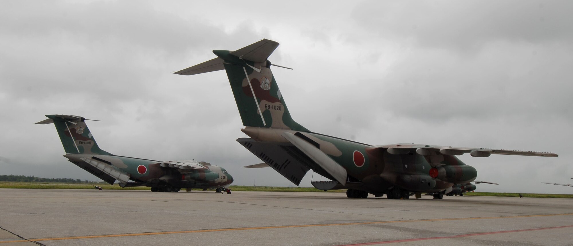YOKOTA AIR BASE, Japan -- Two Japanese Air Self Defense Force C-1's await visiting U.S. Air Force members to tour their hulls, during a bilateral airlift aircraft training on 23 June.(U.S. Air Force photo by SrA Laszlo Babocsi)