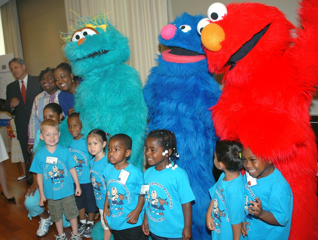 Children from the Andrews Air Force Base, Md., child development center pose for a photo with Sesame Street characters Rosita, Grover and Elmo on June 26, 2008. The muppets were in Washington to help the Sesame Workshop and the United Service Organizations launch "The Sesame Street Experience," the next piece in the workshop's program to help young military children cope with parents' deployments. Defense Dept. photo by Samantha L. Quigley