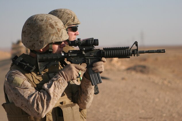 CAMP KOREAN VILLAGE, Iraq (June 26, 2008) ? 1st Lt. Patrick S. Massaro, executive officer, Security Company, Combat Logistics Battalion 6, 1st Marine Logistics Group, scans the horizon during a security halt. Battalion Commander Lt. Col. David J. Eskelund and Battalion Sergeant Major Wayne O. Gallman ventured on a three-day tour of seven locations in the CLB-6 area of operation. The purpose of the tour was to visit with their Marines at all of the detachments and check on the progress of various expansions they are working on. The tour included stops at Korean Village, al-Qaim, Haditha Dam, Gannon II, Tripoli, Rawah and Anah. (Photo by Lance Cpl. Robert C. Medina)