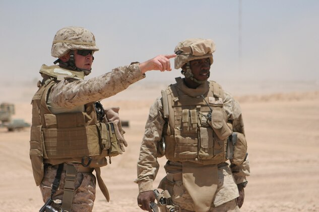 COP GANNON II, Iraq (June 27, 2008) - Lt. Col. David J. Eskelund, battalion commander, Combat Logistics Battalion 6, 1st Marine Logistics Group and Warrant Officer David D. Clerk, support platoon commander, Engineer Company, CLB-6, look over the new location that will be replacing Gannon I. Eskelund and Battalion Sergeant Major Wayne O. Gallman, visited seven locations CLB-6 conducts operations from. The purpose of the visit was to speak face-to-face with their Marines and check on the improvements on projects being built. They also checked the serviceability of equipment vital to mission accomplishment. The locations visited were at Korean Village, Al-Qaim, Haditha Dam, Gannon II, Tripoli, Rawah and Anah. (Photo by Lance Cpl. Robert C. Medina)