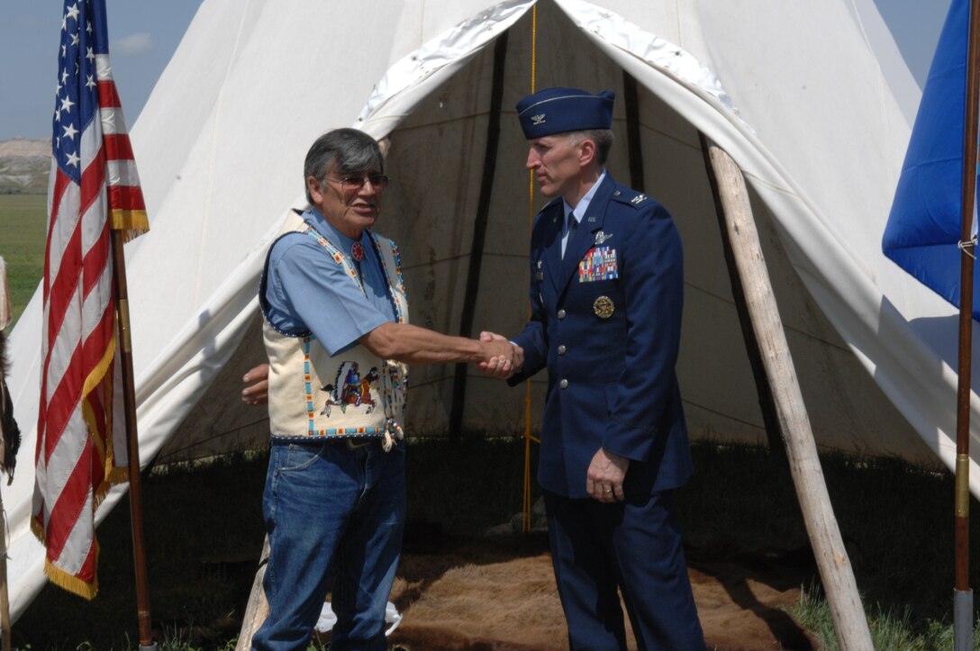Col. Scott Vander Hamm, 28th Bomb Wing commander, Yellow Bird-Steele, Oglala Sioux Tribe president, exchange handshakes at the Tribal Consultation Plan signing held at the White River Visitor Center on the Pine Ridge Reservation, S.D., June 26, 2008. This plan will assure continued communications and emphasize trust, respect and a shared responsibility for the clean-up and reuse of the Air Force Retained Area. It is the Air Force’s goal to protect human health, the environment and facilitate the return of the land to the Oglala Sioux Tribe.  (U.S. Air Force photo/ Airman 1st Class Adam Grant)
