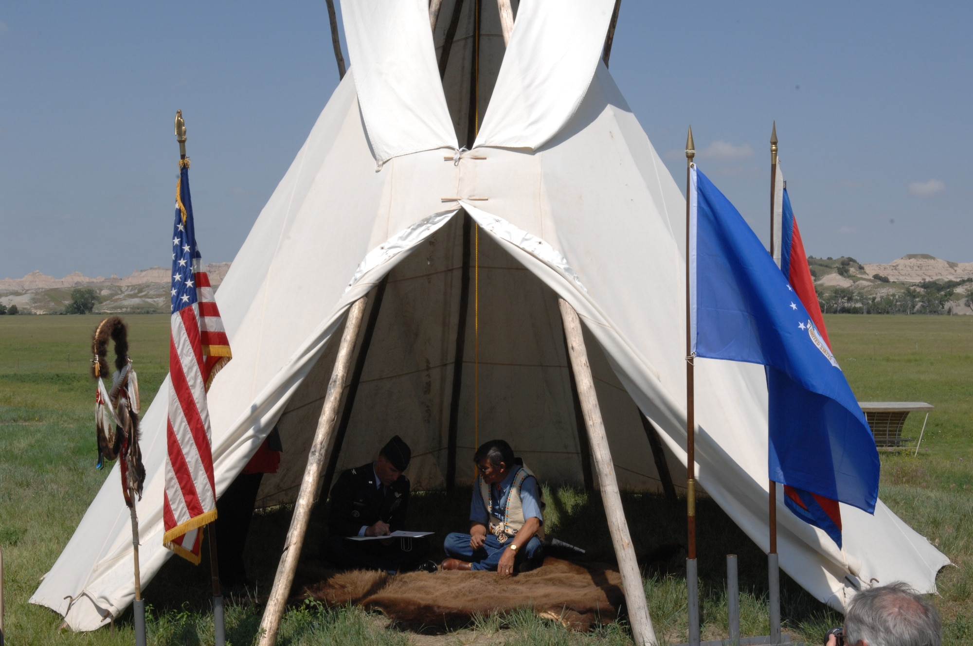 Col. Scott Vander Hamm, 28th Bomb Wing commander, and Yellow Bird-Steele, Oglala Sioux Tribe president, sign a Tribal Consultation Plan at the White River Visitor Center on the Pine Ridge Reservation, S.D., June 26, 2008. In signing this document, the Air Force is making a commitment to establishing open lines of communication between both the Air Force and the Oglala Sioux Tribe with a common goal in mind. (U.S. Air Force photo/ Airman 1st Class Adam Grant)


