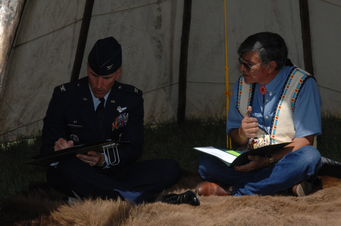Col. Scott Vander Hamm, 28th Bomb Wing commander, and Yellow Bird-Steele, Oglala Sioux Tribe president, sign a Tribal Consultation Plan at the White River Visitor Center on the Pine Ridge Reservation, S.D., June 26, 2008. In signing this document, the Air Force is making a commitment to establishing open lines of communication between both the Air Force and the Oglala Sioux Tribe with a common goal in mind. (U.S. Air Force photo/ Airman 1st Class Adam Grant)

