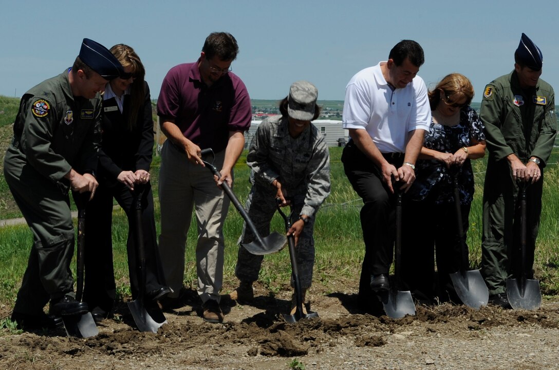 A ground-breaking was held for the new Digital Airport Surveillance Radar site on Radar Hill Road, June 25. The DASR will control all civilian and military aircraft in and out of Rapid City Redional Airport and Ellsworth, and has the potential to feed air traffic radar pictures to Denver Center and the National Air Traffic Control structure. Those who broke ground were (from left to right) Col. Buck Shawhan, 28th Operations Group commander, Tanya Shepper of Rep. Stephanie Herseth-Sandlin's office, Darrel Shoemaker of Sen. Tim Johnson's office, Col. Renita Alexander, 28th Mission Support Group commander, Qusi Al-Haj of Sen. John Thune's office, Sandy Fisher, director of the School of Mines and Technology business services and Col. Peter Castor, 28th Bomb Wing vice commander. (U.S. Air Force photo/Airman 1st Class Kasey Zickmund)
