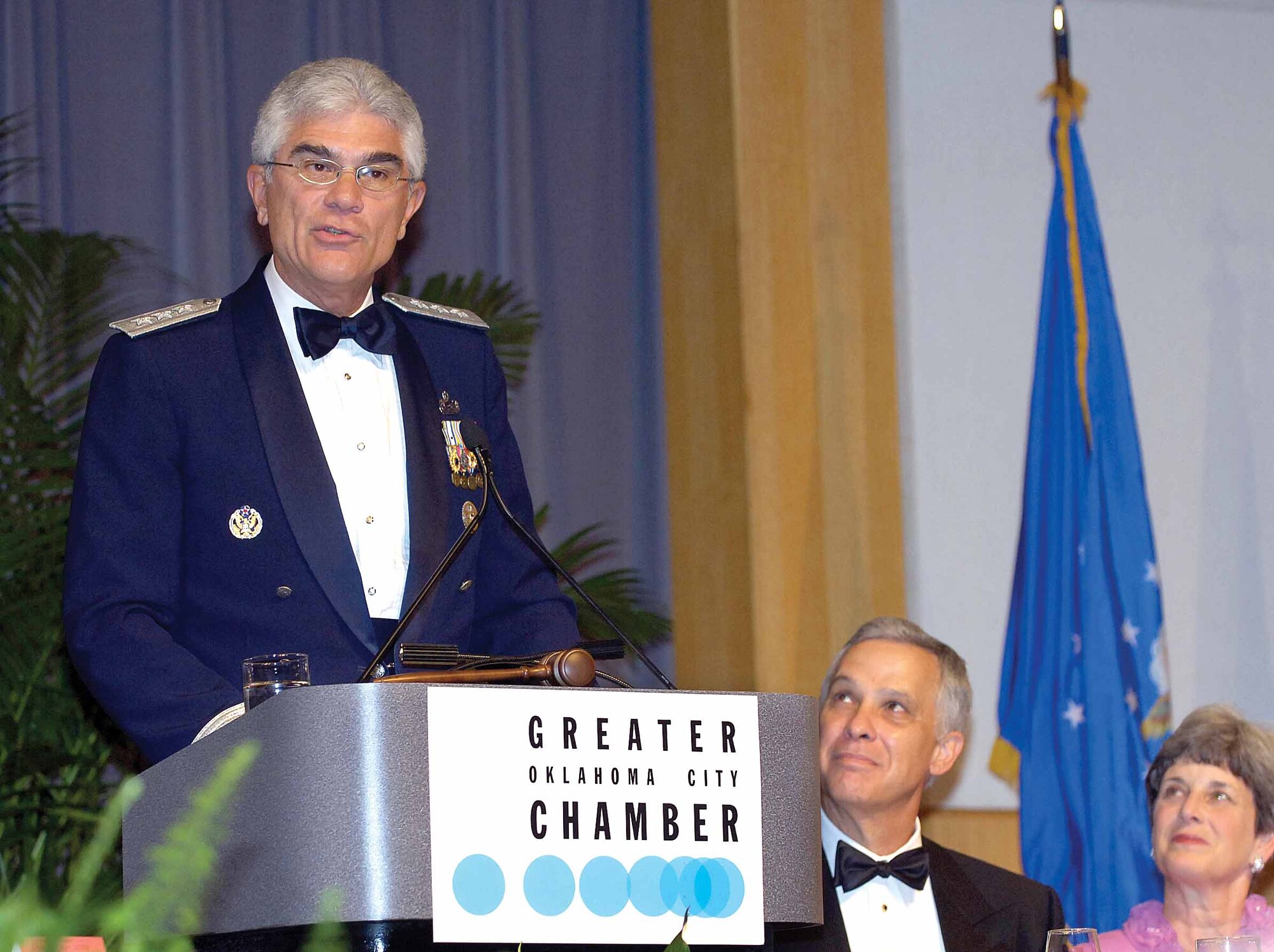 Lt. Gen. John Regni, superintendent of the U.S. Air Force Academy in Colorado Springs, Colo., spoke to hundreds who attended the annual Tinker/Community Ding Out June 19, held at the National Cowboy and Western Heritage Museum in Oklahoma City.  Listening to the general's comments is president of the mess and pat mayor of Oklahoma City, Kirk Humphreys with his wife Danna.  (Air Force photo by Margo Wright)