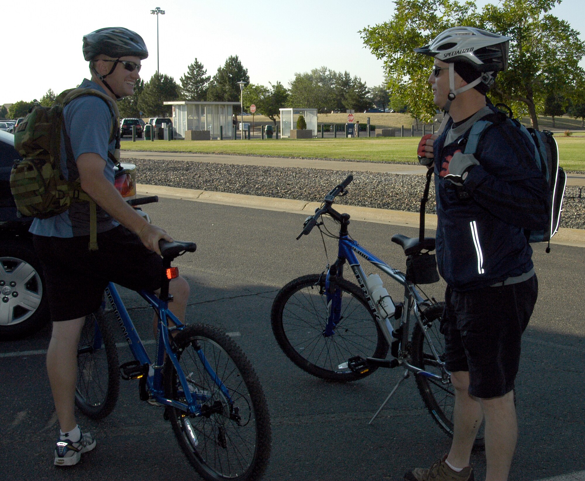 Tech. Sgt. Lee Feldhausen, JA, (left) and Lt. Col. Doug Ottinger, DPX, take a break after biking nearly 20 miles to work during Colorado's Bike to Work Day on June 25. Nearly 40 people from ARPC and DFAS participated in the statewide event. (U.S. Air Force photo/Mike Molina)