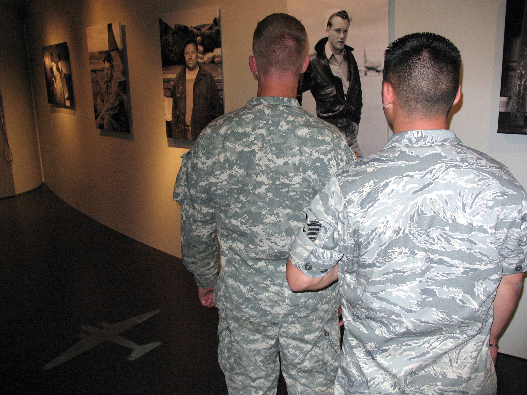 An Airman and Soldier are the first to visit the Berlin Allied Museum's "Making of ..." exhibit highlighting the efforts of the allied and German ground maintainers and logisticians who made possible the now famed airlift from June 26, 1948, to Sept. 27, 1949. This special exhibit opened June 26 as part of the commermorations fo the 60th Anniversary of the Berlin Airlift. (U.S. Air Force photo/Master Sgt. Ron Przysucha)
