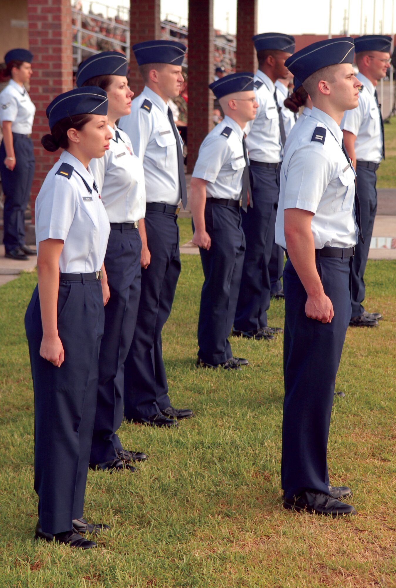 Officers participating in the Pass in Review June 20 stand at attention as the flights march in review. (U.S. Air Force photo by Staff Sgt. John Barton)