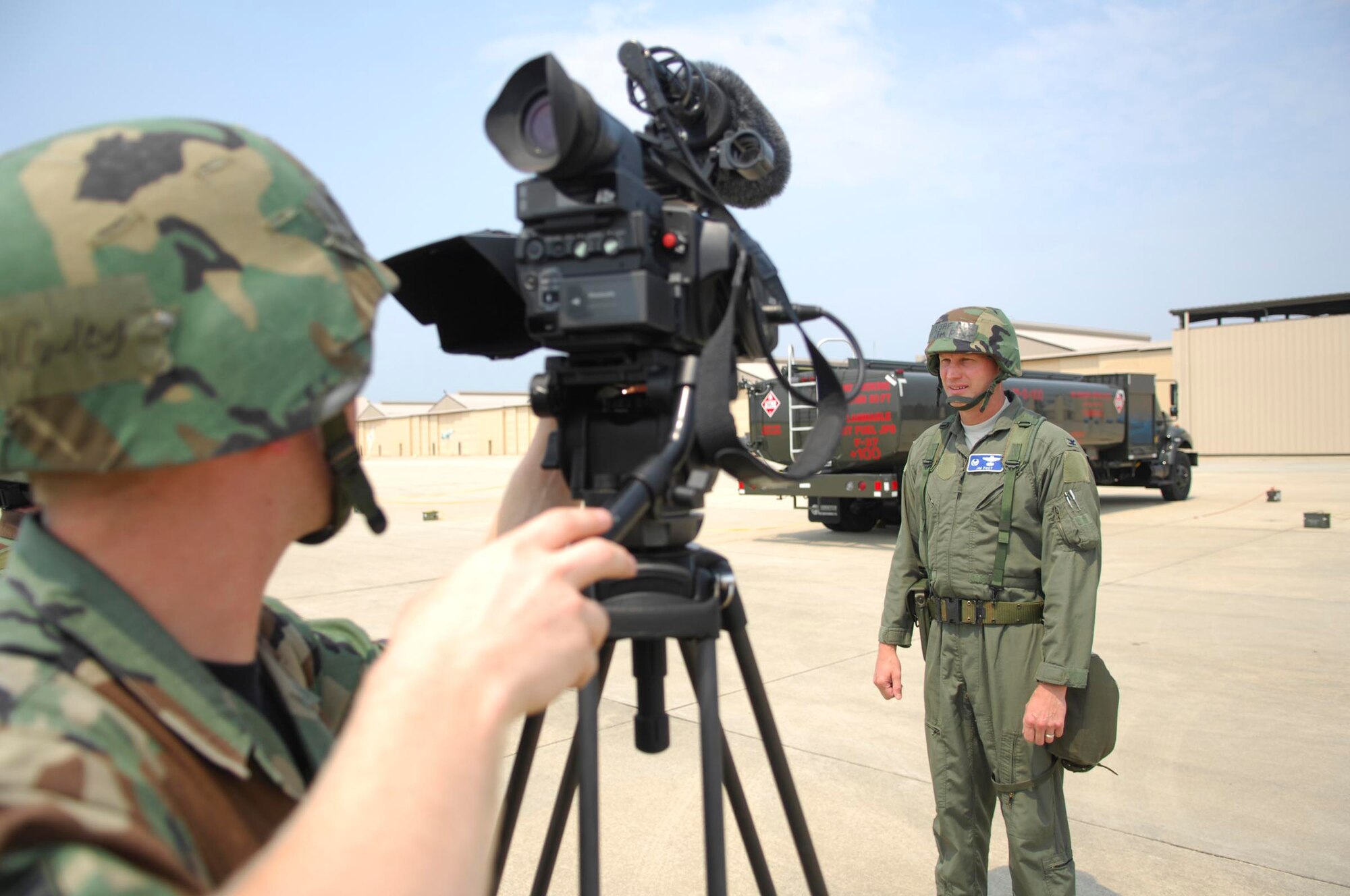 SHAW AIR FORCE BASE, S.C.-- Airman 1st Class Michael Cowley, 20th Fighter Wing Public Affairs videographer, records an interview with Col. James Post, 20th Fighter Wing commander, during a Phase II Operational Readiness Exercise June 26.  Operational Readiness Exercises provide vital training and prepare Airmen for worldwide deployment. (U.S. Air Force photo/Senior Airman William Coleman)