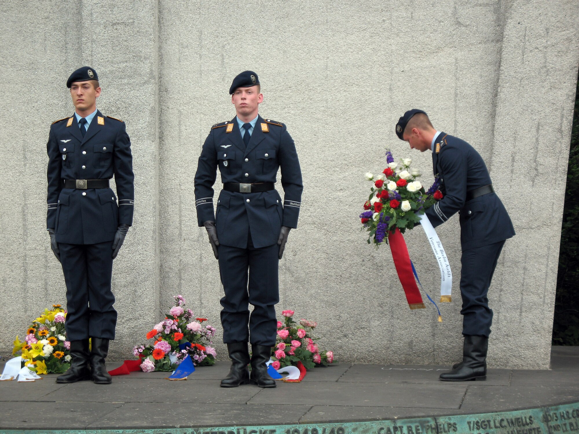 A German airmen lays a wreath at the Berlin Airlift Memorial outside of Tempelhof airport June 27 in Berlin. The ceremony honored the 78 airmen who gave their lives to sustain Berliners from June 24, 1948, to May 12, 1949. (U.S. Air Force photo/Master Sgt. Ron Przysucha) 
