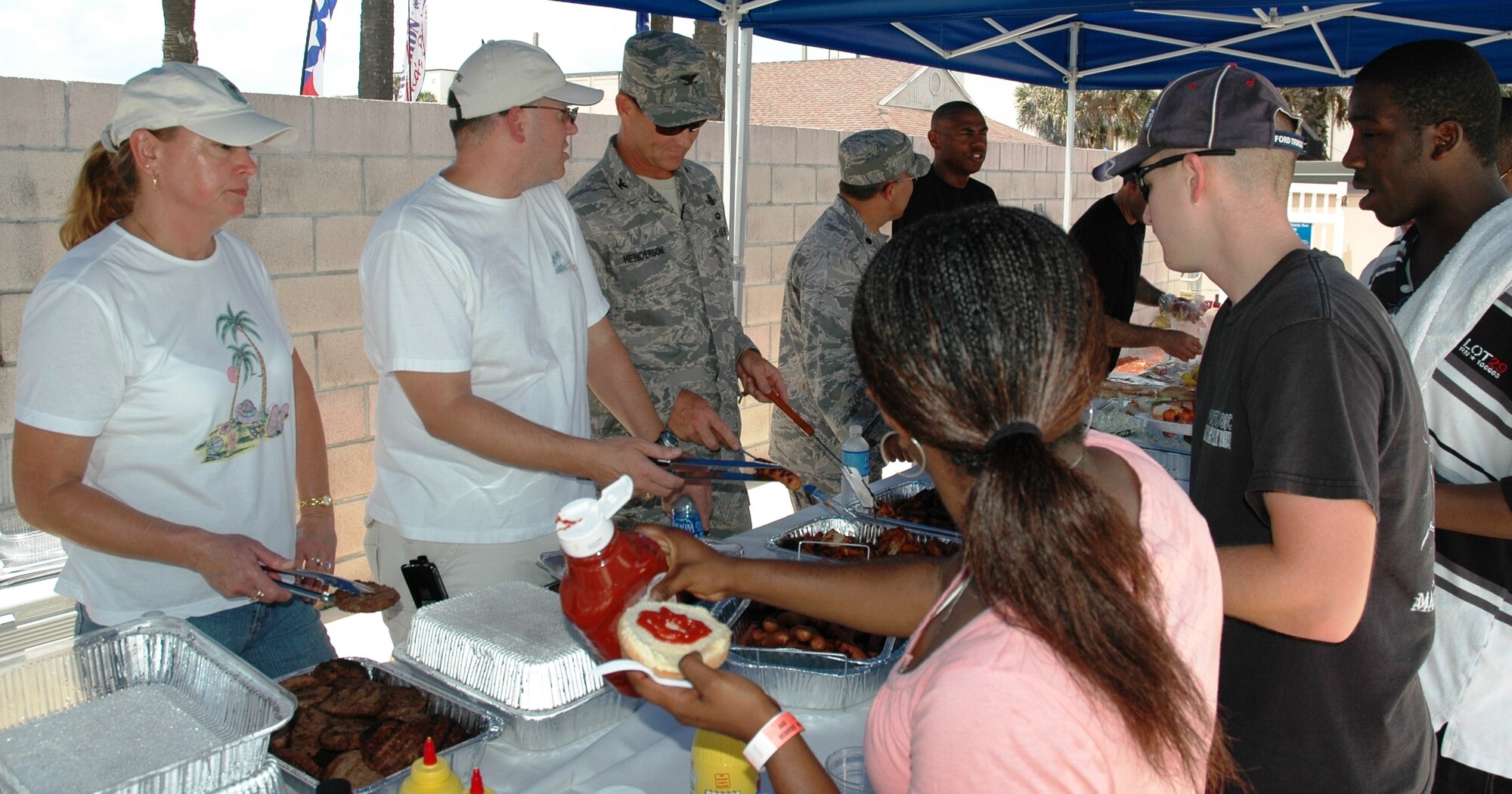 Burgers are always good, especially when they are served by your group commander; in this case Col. Scott Henderson, the 45th Launch Group commander (U.S. Air Force photo by Airman 1st Class David Dobrydney).