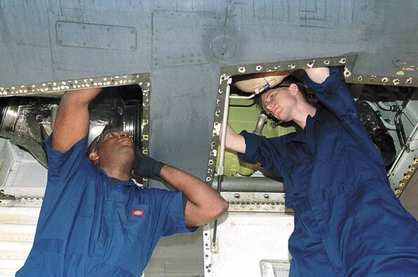 Airmen from the 654th Combat Logistics Support Squadron at Tinker Air Force Base, Okla., work on a B-1. The squadron, which has provided mobile logistics support throughout the world since 1967, will inactivate July 2. (Air Force photo by Margo Wright) 