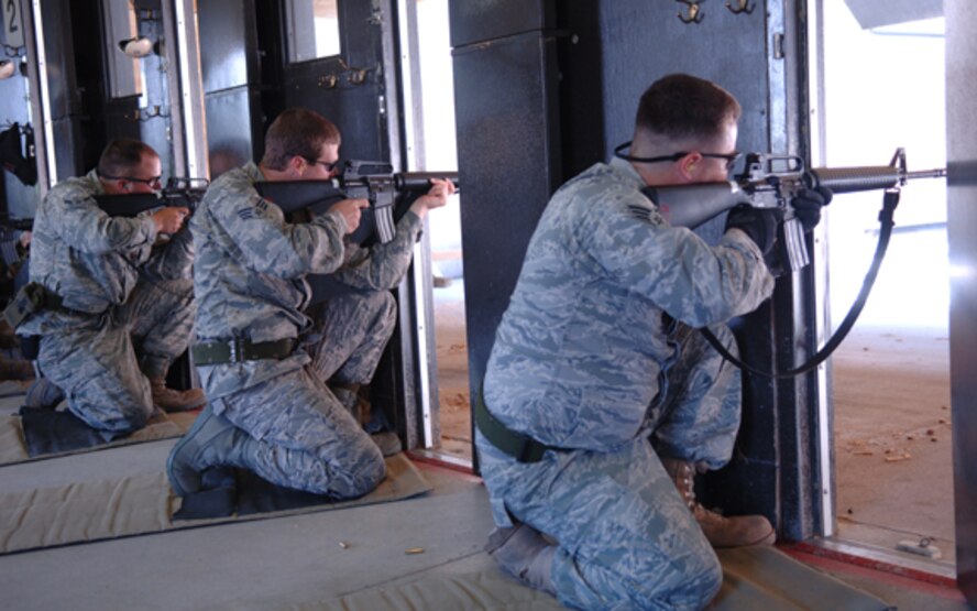 MINOT AIR FORCE BASE, N.D. -- Airmen fire M-16 rifles down range during augmentee training here June 25. Augmentees are volunteer Airmen from a wide variety of Air Force career fields who assist the 5th Security Forces Squadron by performing base security duties; enabling regular SFS personnel to perform other roles in support of air base defense. Augmentees are given specialty training in weapons, possible scenarios, rules of engagement and use of force. (U.S. Air Force photo by Airman 1st Class Sharida Bishop)