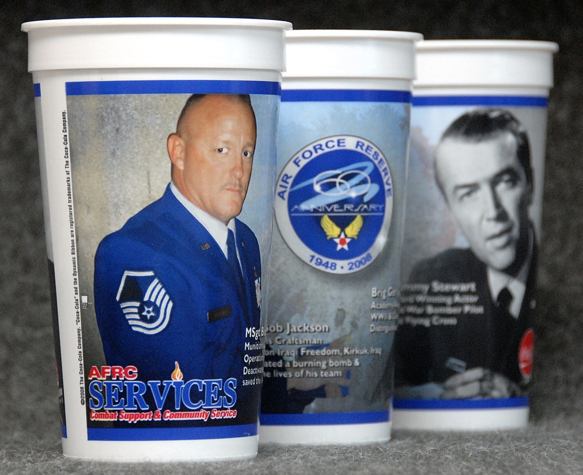 Drink cups commemorating the 60th Anniversary of the Air Force Reserve feature Master Sgt. Bob Jackson from the 442nd Maintenance Squadron's Munitions Flight, as well as retired Brig. Gen. and actor Jimmy Stewart.  (U.S. Air Force photo/Master Sgt. Bill Huntington)
