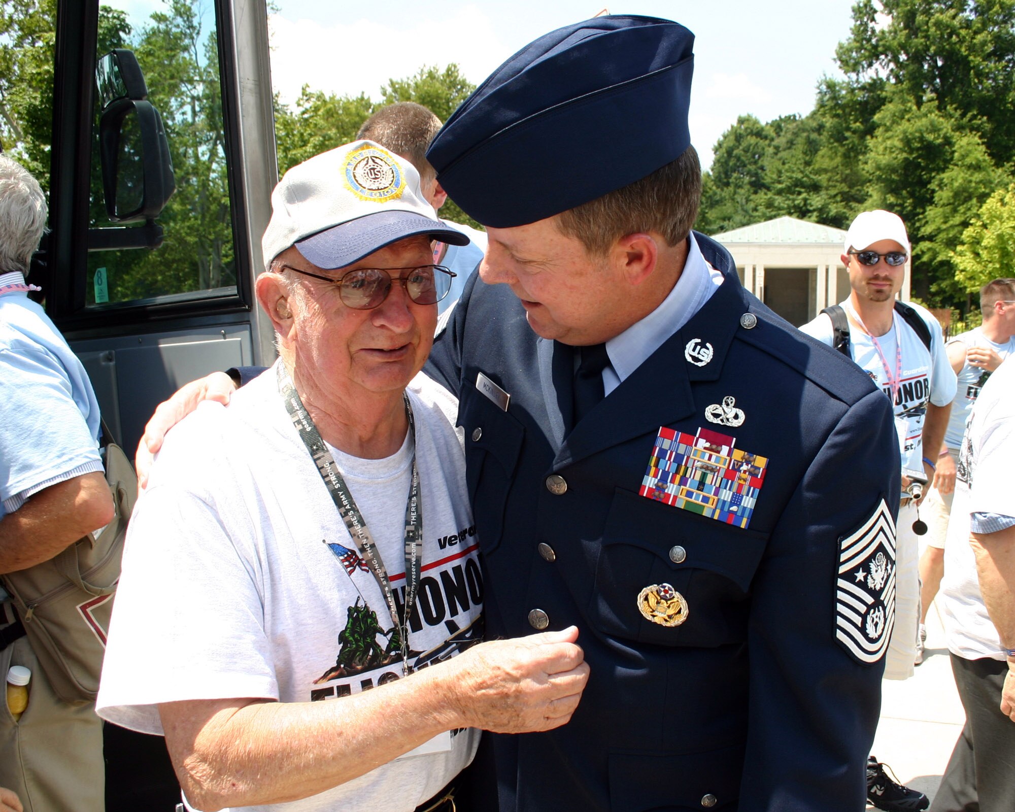 Richard McKinley (left) reacts after being surprised by a visit June 25 from his nephew, Chief Master Sgt. of the Air Force Rodney J. McKinley, during a trip to the World War II Memorial in Washington, D.C. (U.S. Air Force photo/Senior Master Sgt. Raymond Sarracino) 
