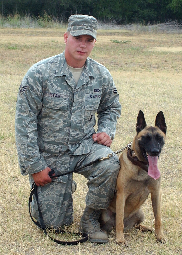 6/18/2008 - Senior Airman Shawn Ryan, a student at the Department of Defense Military Working Dog Program at Lackland, poses with his dog Laikia.  
(USAF photo by Sid Luna)
