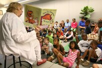 6/16/2008 - Alice Serafin reads "How Do Dinasaurs Eat Their Food?" to second and third graders at the Lackland Youth Center during the kickoff to the summer reading program. This year's theme is Back to the Future and runs until July 31. The program moves from dinosaurs in the prehistoric past to an alien visitor?s party. For more information, call the library at 671-3610.
(USAF photo by Robbin Cresswell)
