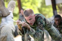 6/11/2008 - Air Force Academy Cadet 3rd Class Matthew Thomas navigates an obstacle at the basic military training obstacle course.  Cadet Thomas is taking part in Lackland's Summer Leadership Program to observe how military training instructors turn a flight of approximately 50 trainees into a team.
(USAF photo by Robbin Cresswell)