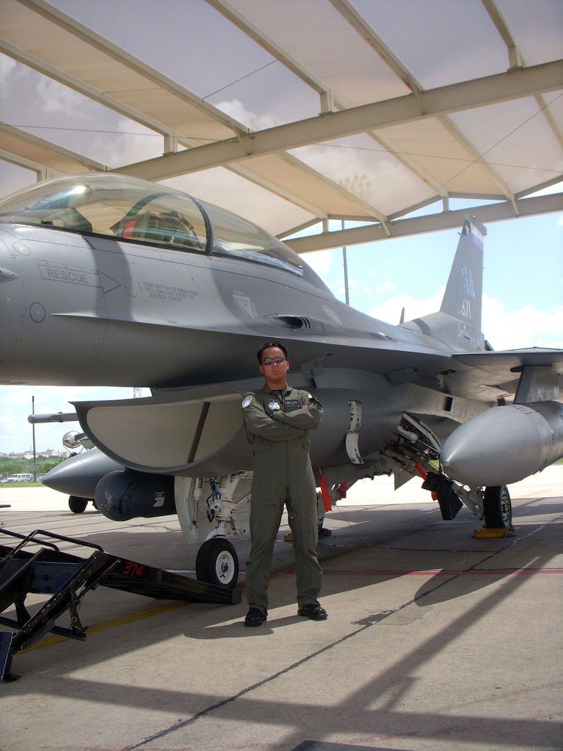 6/10/2008 - Air Force Academy Cadet 1st Lieutenant Chris Smith stands in front of the F-16 he got to fly recently.  Cadet Smith has been getting hands-on experience at Lackland Air Force Base through Operation Air Force, a summer program allowing him to experience the Air Force before he graduates from the academy.          
(USAF photo by Meredith Canales)