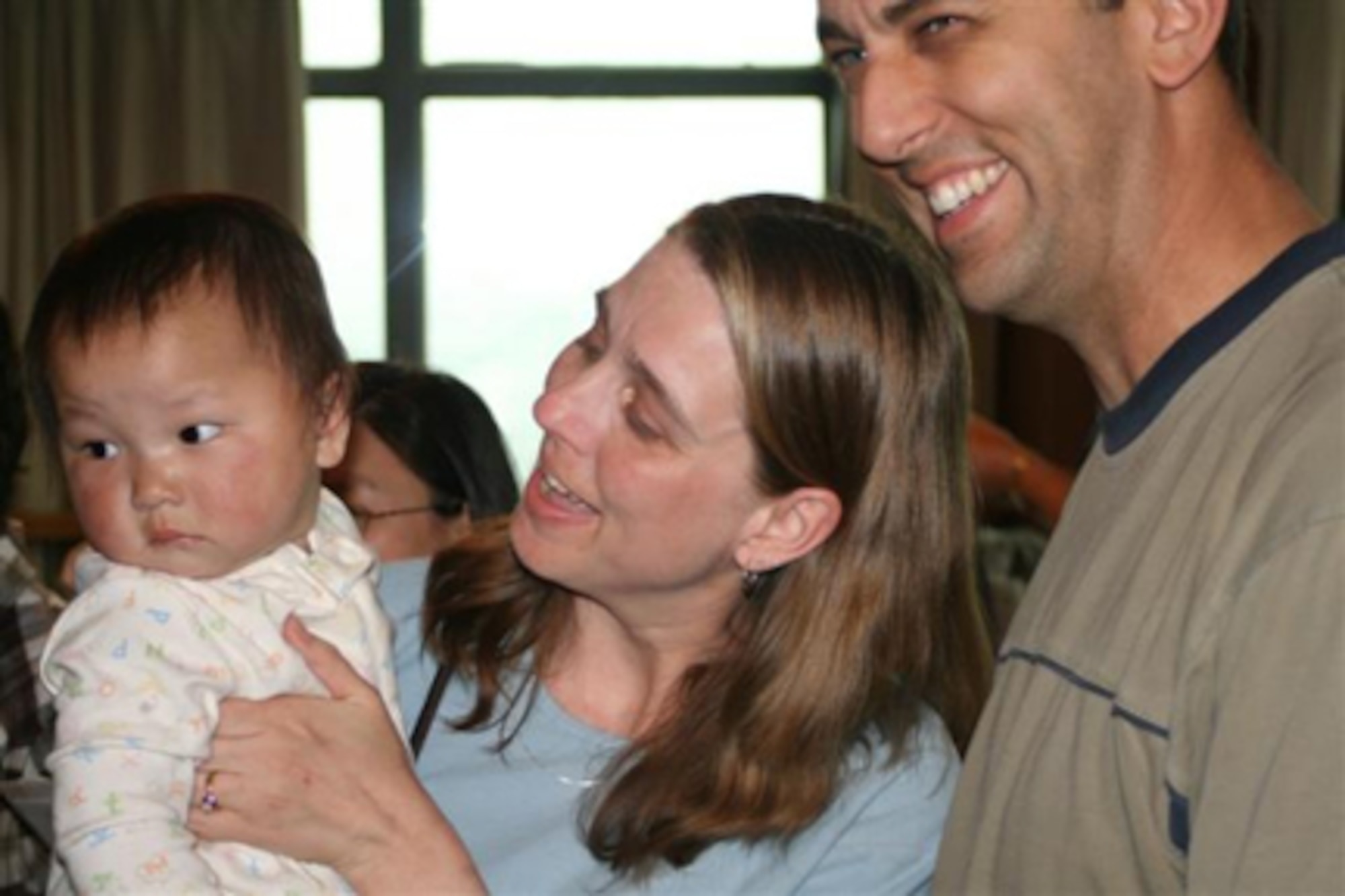 SPANGDAHLEM AIR BASE, Germany – Master Sgt. Allen and Dawn Orahood are all smiles after meeting Sarah AlisonMei Orahood, their newly adopted daughter. The couple started the adoption application process in August 2005; however, due to a back-logged adoption system in China, a standard 9-month adoption process took 26 months. Sergeant Orahood is assigned to the 52nd Maintenance Group. Courtesy photo