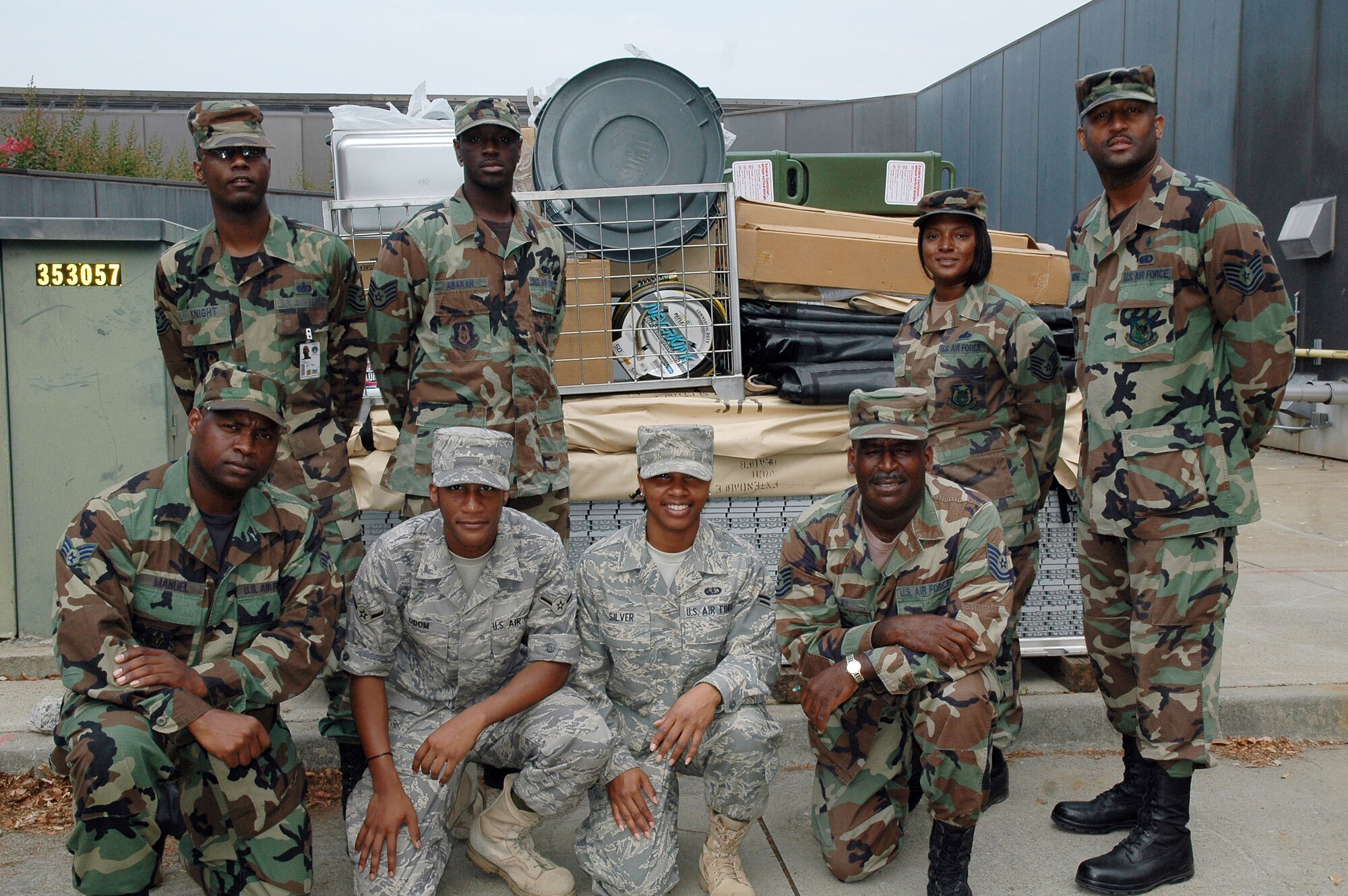 Members of the 94th Services Squadron pose in front of a pallet used for the Prime Readiness in Base Services traininig facility on base. Prime RIBS provide resources such as deployable kitchens used for peacetime and wartime contingencies. The pallet includes generators, trash cans, temper tents, and food burners. When assembled, the unit can provide field feeding for up to 550 people. Pictured: Front row from left to right: Senior Airman Lorenzo Manuel, Airman Adrius Odom, Airman 1st Class LaToya Silver and Tech. Sgt. Ellis Riley. Back row from left to right: Tech. Sgts. Jermaine Knight and  Bobby Abakah, Master Sgt.  April Lee, and  Tech. Sgt. Richard Moore (U.S. Air Force photo/Erin Tindell).